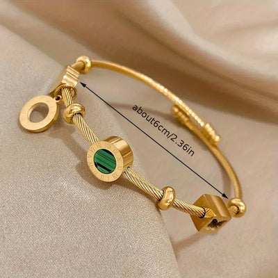 Pulseira rígida dourada com pingentes geométricos - Celeste