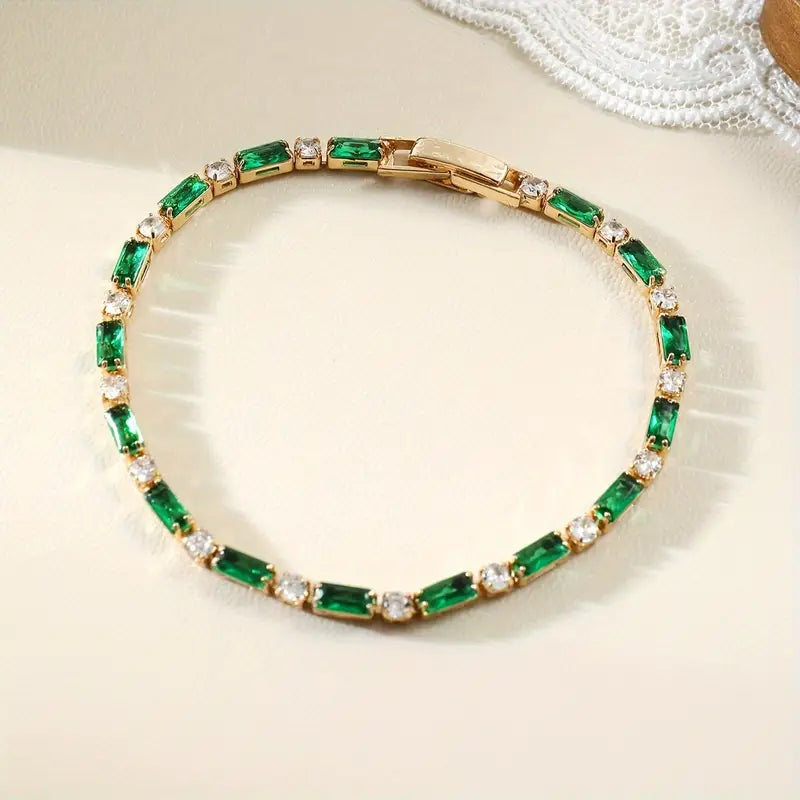 Pulseira dourada com pedras de corte esmeralda - Armonia