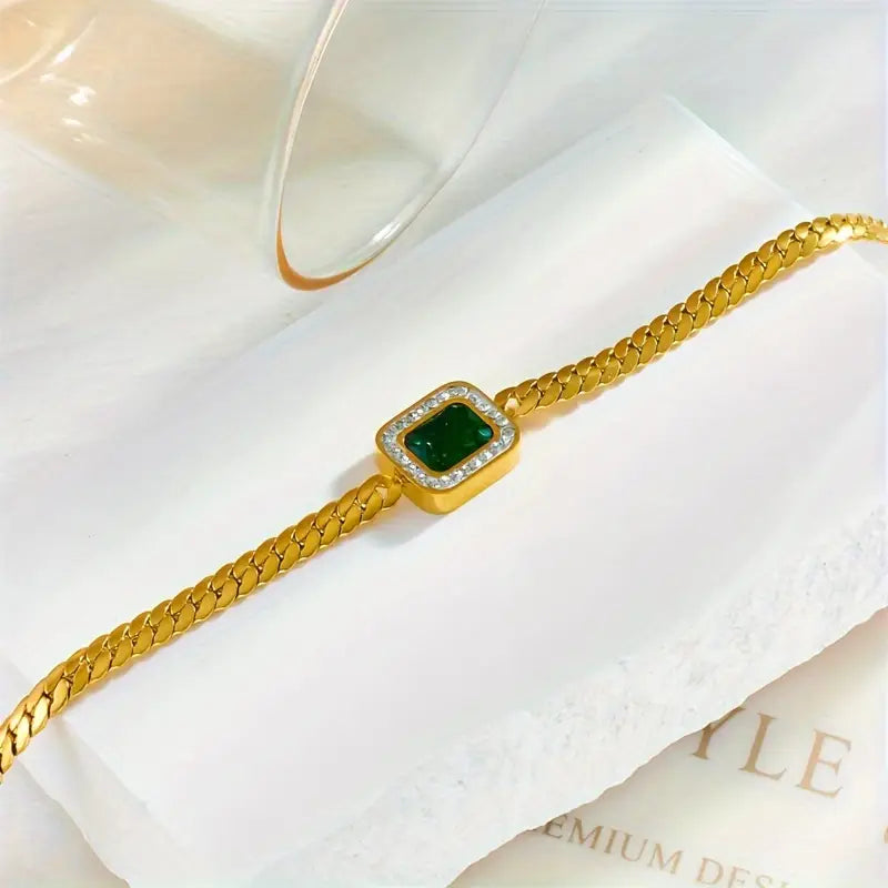Pulseira dourada com cristal verde retangular - Liriel