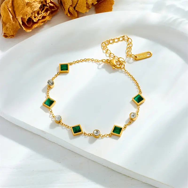 Pulseira dourada com cristais verdes e brancos - Ravenna