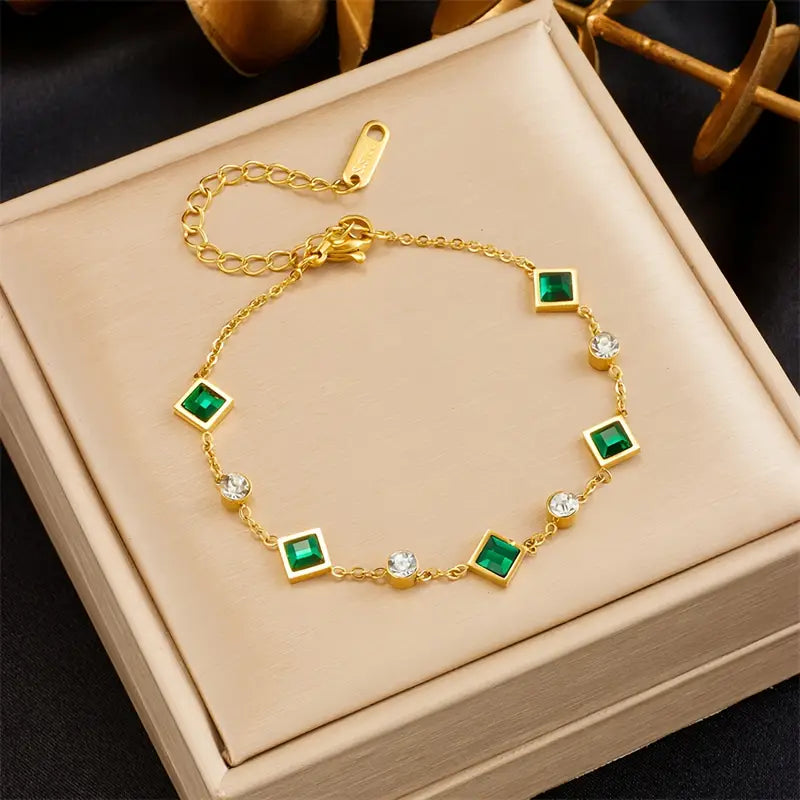 Pulseira dourada com cristais verdes e brancos - Ravenna