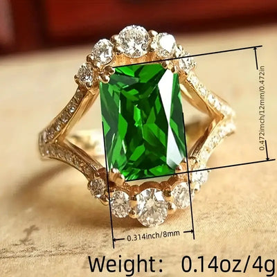 Anel dourado com cristal verde retangular - Lorien