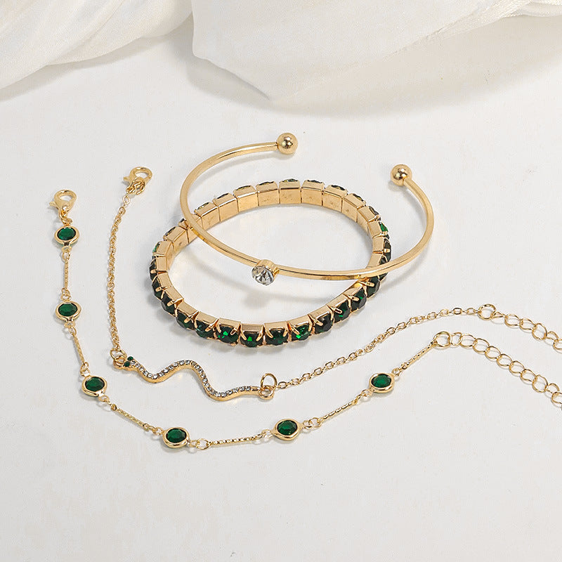 Conjunto de pulseiras douradas com pormenores verdes - Smeralda