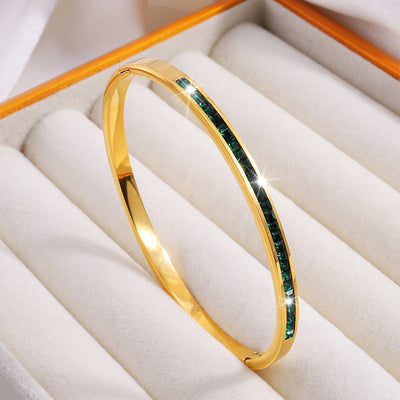 Pulseira rígida dourada com cristais verdes - Mirella