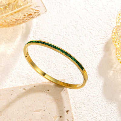 Pulseira rígida dourada com cristais verdes - Mirella