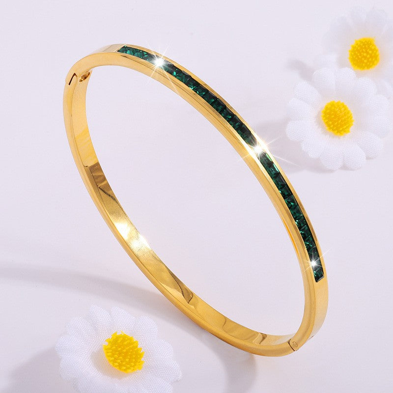 Pulseira rígida dourada com cristais verdes - Mirella