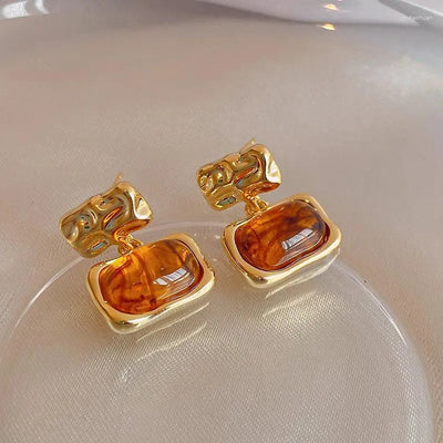Brincos em forma de gota com moldura fundida - Mireya